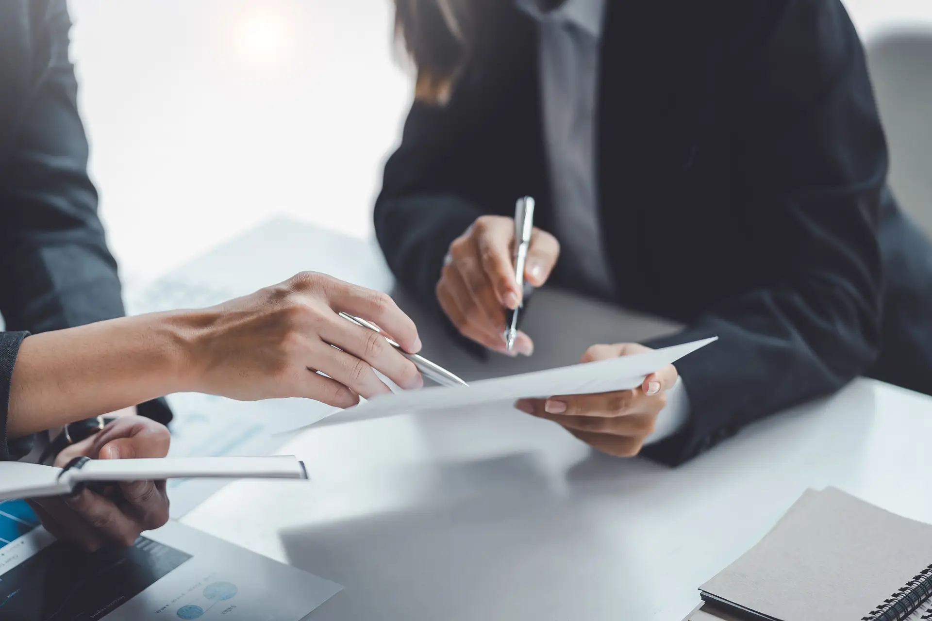 A close up of an S-Corporation election form next to a calculator.